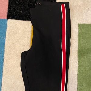 Black leggings with red stripe